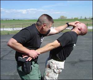 One effective technique for retaining your holstered firearm is to secure the wrist and strike the face.