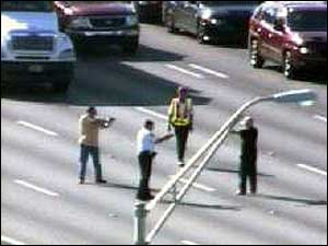 Manblockingtraffictaseredbyflo 10249272