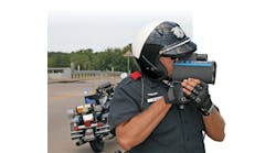 Traffic Officer Mitch Lee of the Grand Prairie (Texas) PD demonstrates the DBC-equipped Laser Tech Ultra Lyte Lidar device, which can calculate accurate measurements between vehicles, both in distance and time.