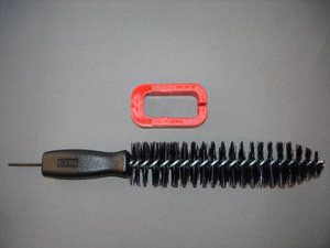 The mag-clamp tool and the brush provided in the kit.
