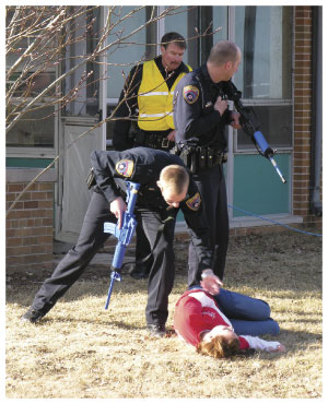 First responders in the Concordia University Wisconsin training check the status of a victim.