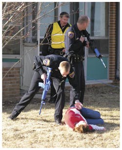 First responders in the Concordia University Wisconsin training check the status of a victim.