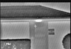 The TI clearly identifies the heat pad located on the front of the house near the roof gutter.