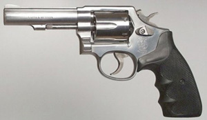 Representing the traditional police revolver: a stainless steel Smith & Wesson Model 64, .38 Special with a 4' bull barrel.