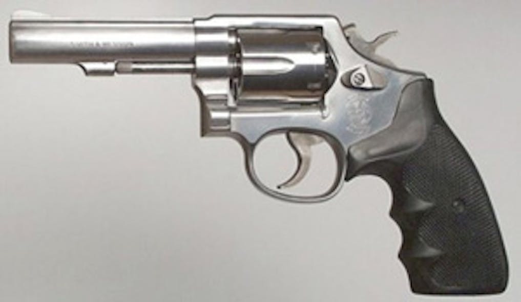 Representing the traditional police revolver: a stainless steel Smith &amp; Wesson Model 64, .38 Special with a 4&apos; bull barrel.