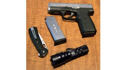 The ITC HX120 shown with a Buck Knives Vantage Pro folding lockblade, the author&apos;s Kahr CW4543 .45ACP pistol and one spare magazine for same.