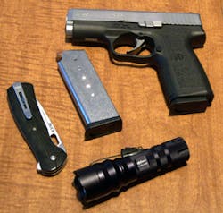 The ITC HX120 shown with a Buck Knives Vantage Pro folding lockblade, the author's Kahr CW4543 .45ACP pistol and one spare magazine for same. The ITC HX120 shown with a Buck Knives Vantage Pro folding lockblade, the author's Kahr CW4543 .45ACP pistol and one spare magazine for same.
