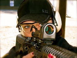 Sgt. Sanela Latarski, FRPD (NY). Photo shows incongruity of a competent officer aiming an AR-style rifle... with painted nails.