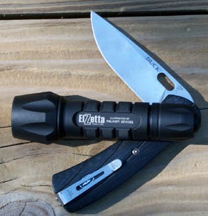 Shown resting on a Buck Pro Vantage knife, the ZFL-M60 took quite a bit of abuse and kept on running.