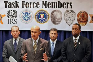 Law enforcement officials take questions on a federal racketeering indictment that accuses members of the Armenian Power gang of a range of offenses.