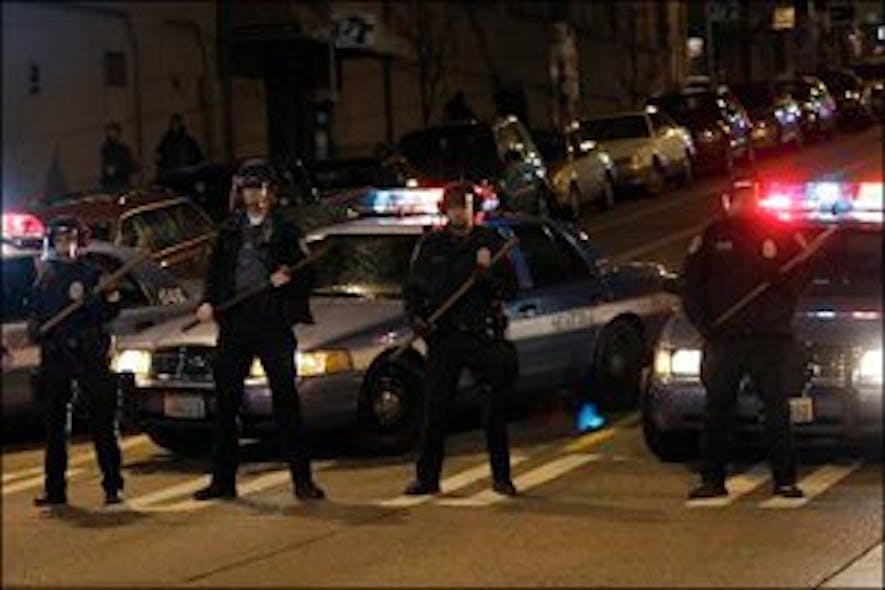 Police stand down protesters who marched to within a block of a precinct station during a night-time protest march against SeattleOfficer Ian Birk.