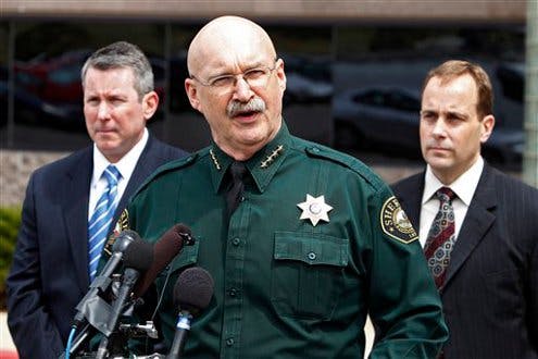 Jefferson County Sheriff Ted Mink, center, is flanked by FBI Special Agent in Charge Jim Yacone, right, and ATF Assistant Special Agent in Charge Luke Franey, left, during a news conference.