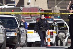 Police officers work the scene at Creighton University Medical Center, Wednesday, April 6 Police officers work the scene at Creighton University Medical Center, Wednesday, April 6