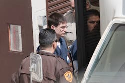 Keith Randulich steps onto a transport bus at the Will County Courthouse on April 14. Keith Randulich steps onto a transport bus at the Will County Courthouse on April 14.