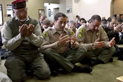 Syed Arif Rizvi, from left, president of the Islamic Center of the San Gabriel Valley in California, joins Deputy Sherif Morsi and Sgt. Mike Abdeen in prayers. Syed Arif Rizvi, from left, president of the Islamic Center of the San Gabriel Valley in California, joins Deputy Sherif Morsi and Sgt. Mike Abdeen in prayers.
