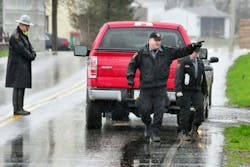 Pennsylvania State Police work at the scene of a fatal shooting in New Hollandon April 13.