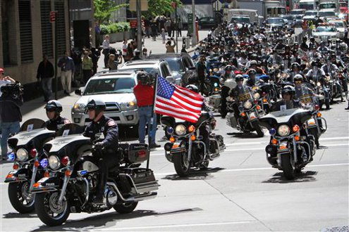 Participants in the Blue Valor Run make their way onto West St. at the start of the first annual Blue Valor Run.