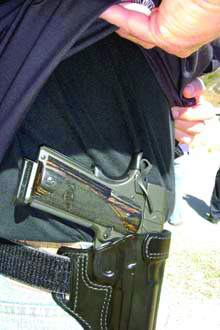 With the right holster and right attire, carrying a full-size pistol is no problem. Here a member of the famed LAPD SIS is carrying their custom SIS .45 autoloader.
