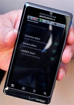 A cell phone enabled to receive emergency notifications, is shown. A cell phone enabled to receive emergency notifications, is shown.