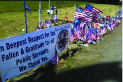 Part of the flag displays and memorials along the processional route. Part of the flag displays and memorials along the processional route.