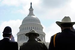 Police officers from Great Britain, left, California, center, and Arizona salute during the 13th annual National Peace Officer's Memorial Service. Police officers from Great Britain, left, California, center, and Arizona salute during the 13th annual National Peace Officer's Memorial Service.