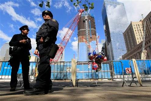 NYPD officers stand guard outside ground zero ahead of President Barack Obama's visit.