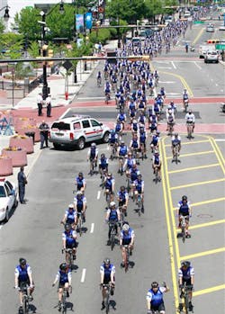 Bicycling police officers from across the nation peddle through Newark, N.J., during the Police Unity Tour. Bicycling police officers from across the nation peddle through Newark, N.J., during the Police Unity Tour.