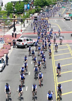 Bicycling police officers from across the nation peddle through Newark, N.J., during the Police Unity Tour. Bicycling police officers from across the nation peddle through Newark, N.J., during the Police Unity Tour.