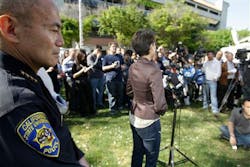 San Jose State University Police Chief Peter Decena, left, listens to SJSU director of media relations Pat Lopes Harris. San Jose State University Police Chief Peter Decena, left, listens to SJSU director of media relations Pat Lopes Harris.