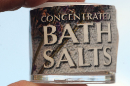 A sample of a bath salt product named TranQuility, which contains the band chemical MDPV is displayed.