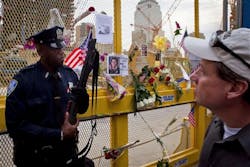 Port Authority Officer Neil Simon stands guard on the perimeter of ground zero. Port Authority Officer Neil Simon stands guard on the perimeter of ground zero.