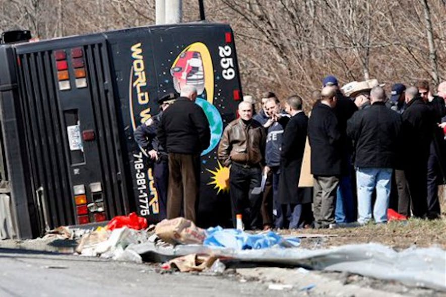 Police Commissioner Raymond Kelly speaks with emergency personnel investigating the scene of a bus crash on March 12.