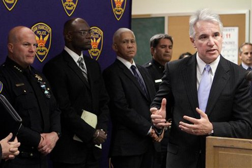 San Francisco District Attorney George Gascon, right, speaks during a news conference.