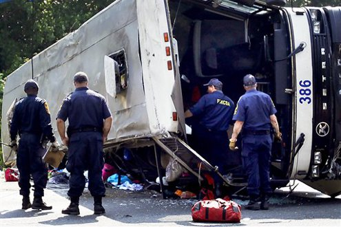 The Virginia State Police Accident Reconstruction Team and Motor Carrier Safety Team inspect a bus that was involved in a single-vehicle accident.