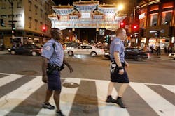 Washington, D.C. police officers Germaine Bennett, left, and Josh Starnes patrol Chinatown. Washington, D.C. police officers Germaine Bennett, left, and Josh Starnes patrol Chinatown.