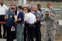 Law enforcement work near the Pentagon after a suspicious vehicle forced mulitple road closures. Law enforcement work near the Pentagon after a suspicious vehicle forced mulitple road closures.