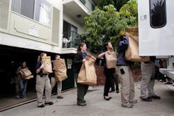 FBI agents load evidence bags into a truck outside an apartment complex where James 'Whitey' Bulger lived. FBI agents load evidence bags into a truck outside an apartment complex where James 'Whitey' Bulger lived.