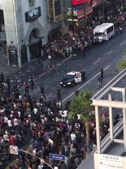 Police hold back a crowd outside Grauman's Chinese Theater in the Hollywood section of Los Angeles. Police hold back a crowd outside Grauman's Chinese Theater in the Hollywood section of Los Angeles.