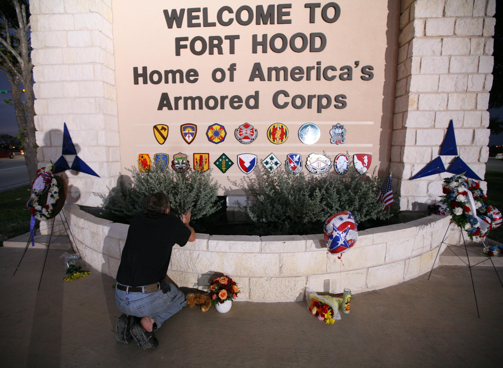 Todd Spittler pays his respects to the victims of the Fort Hood shooting at the main gate of Fort Hood on Nov. 7, 2009.