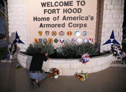Todd Spittler pays his respects to the victims of the Fort Hood shooting at the main gate of Fort Hood on Nov. 7, 2009. Todd Spittler pays his respects to the victims of the Fort Hood shooting at the main gate of Fort Hood on Nov. 7, 2009.