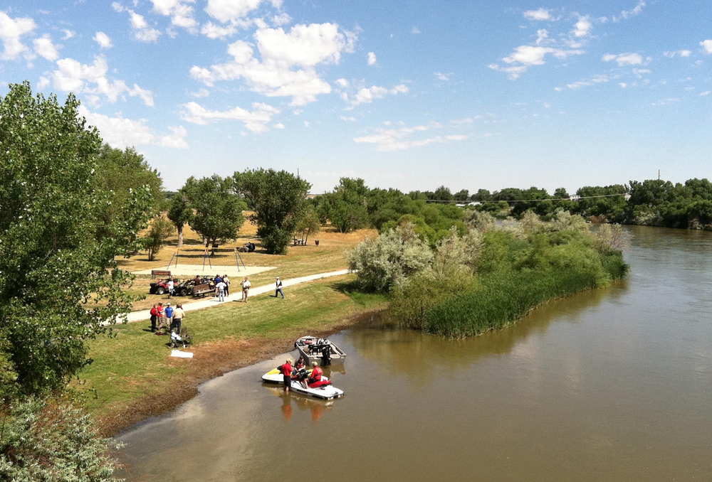 Rescuers meet at a command center along the North Platte River in the search for Deputy Bryan Gross.