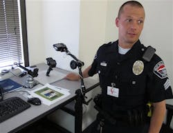 West Valley City Police Sgt. Mike Powell extracts data from a cell phone at the FBI's digital forensics lab. West Valley City Police Sgt. Mike Powell extracts data from a cell phone at the FBI's digital forensics lab.