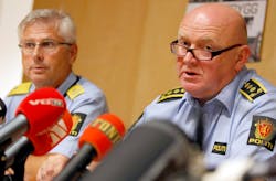 Deputy Chief of Police Sveinung Sponheim, left, and Police Chief of Staff Johan Fredriksen, center, are seen during a press conference.