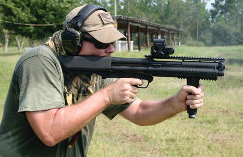 The author operates the Kel-Tec KSG 12 gauge shotgun. (note bottom ejected shell)