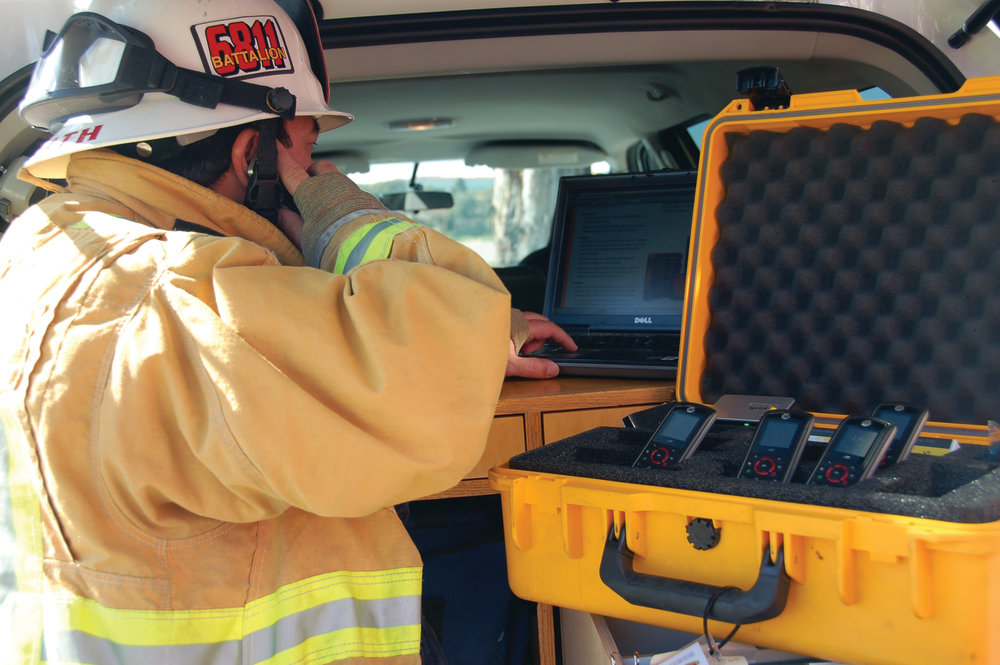 A first responder utilizes the Sprint ERT Go-Kit for emergency communications.