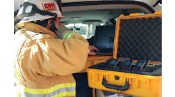 A first responder utilizes the Sprint ERT Go-Kit for emergency communications.