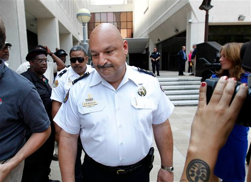 New Orleans Police Deputy Superintendent Kirk Bouyelas leaves Federal Court the officers were convicted.