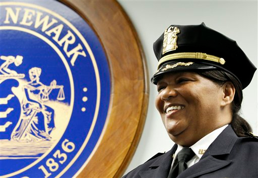Sheilah Coley smiles as she is officially presented as the department's first female police chief.