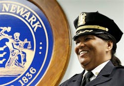 Sheilah Coley smiles as she is officially presented as the department's first female police chief. Sheilah Coley smiles as she is officially presented as the department's first female police chief.