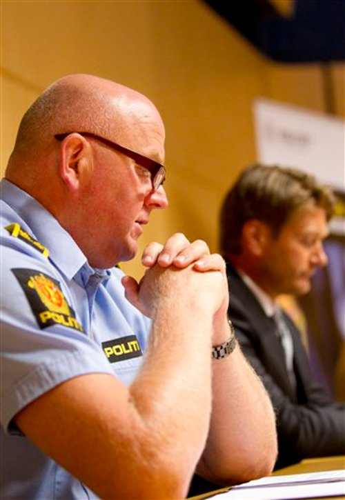 Police Chief of Staff Johan Fredriksen, left, attends a news conference in Oslo.